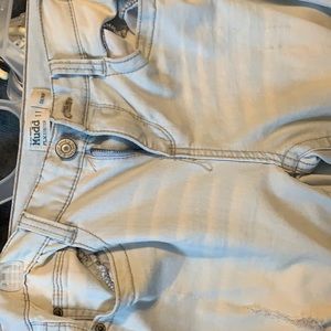 really light washed jeans. Women’s. Two rips